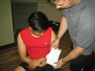 Applying Gauze and a Drainage Dressing for a Wound on the Arm